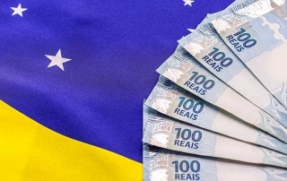 600 reais doe auxilio emergencial sobre a bandeira do Brasil